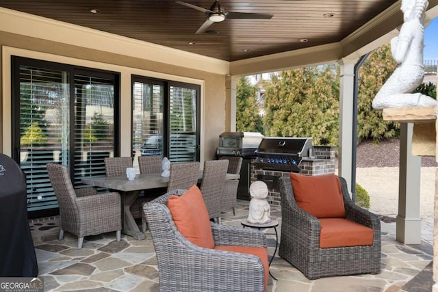 view of patio with area for grilling, grilling area, and ceiling fan