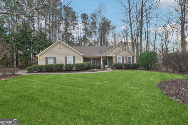 ranch-style home with a front lawn