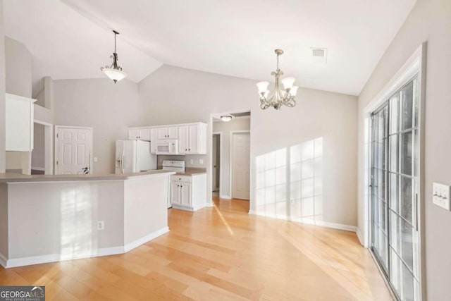 kitchen featuring white cabinetry, pendant lighting, white appliances, and light hardwood / wood-style floors