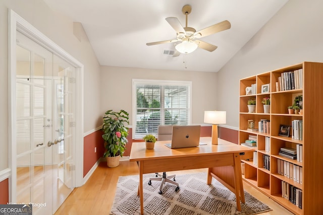 office area with ceiling fan, lofted ceiling, light wood-type flooring, and french doors