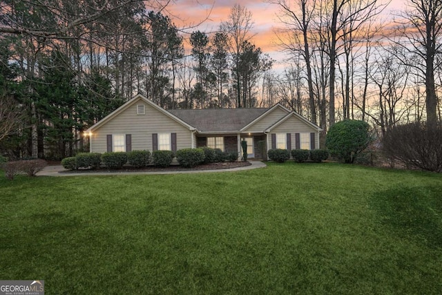 ranch-style house with a lawn