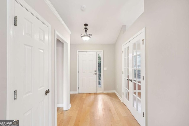 entryway featuring french doors and light hardwood / wood-style floors