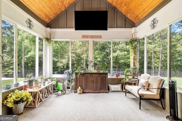 sunroom / solarium with lofted ceiling and wooden ceiling