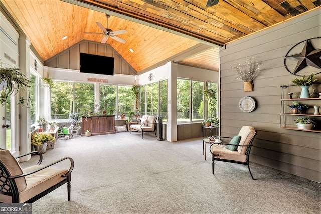 sunroom / solarium with ceiling fan, plenty of natural light, lofted ceiling, and wooden ceiling