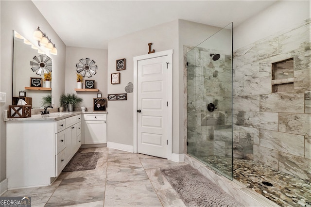 bathroom with vanity and tiled shower