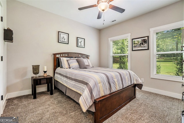 carpeted bedroom with ceiling fan