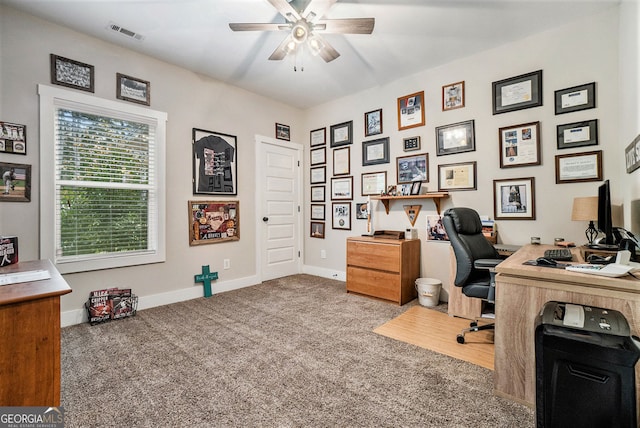 carpeted office with ceiling fan