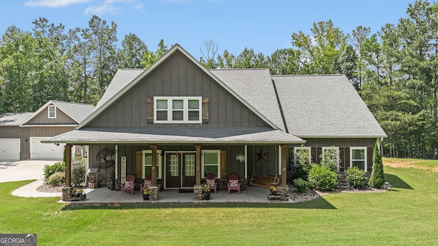 view of front of property with a garage and a front lawn