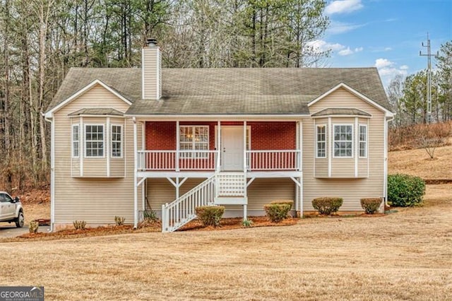 bi-level home featuring covered porch