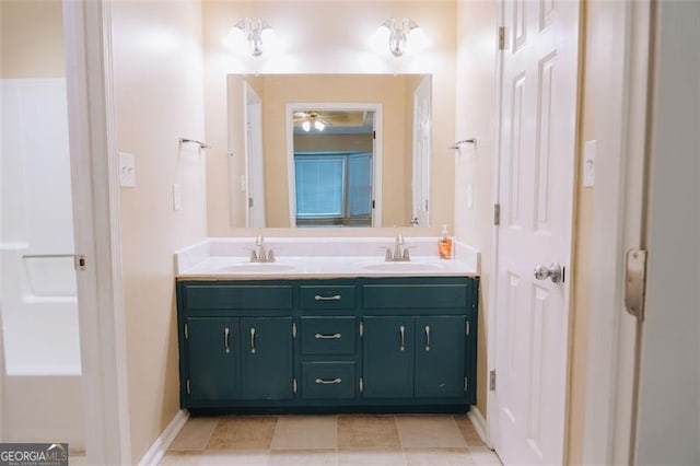 bathroom with vanity and tile patterned flooring