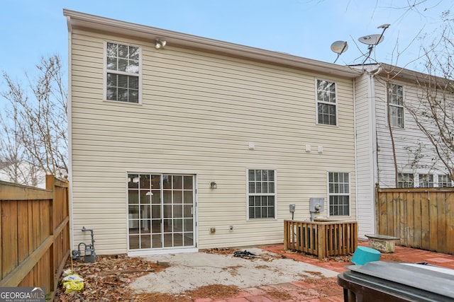 back of house with a patio area