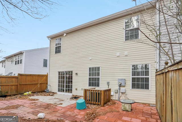 rear view of property with a patio area