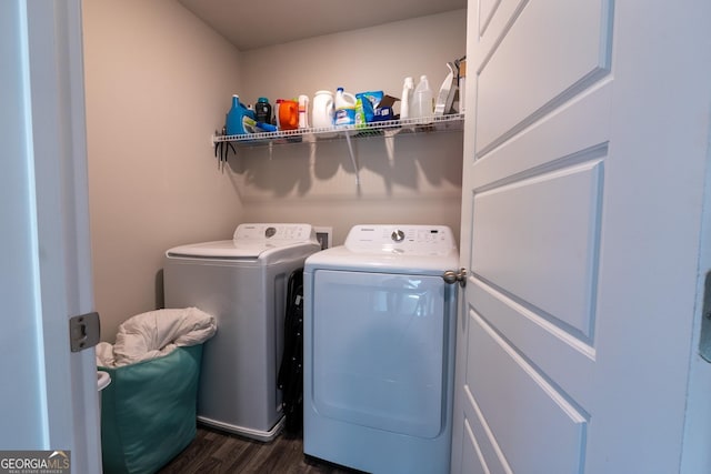 laundry room featuring laundry area, separate washer and dryer, and dark wood-type flooring