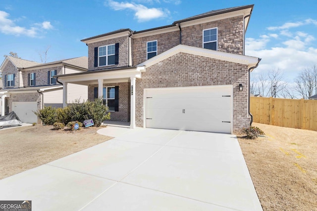 view of front of property with concrete driveway, an attached garage, fence, a porch, and brick siding