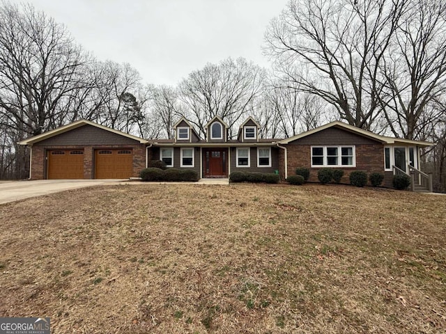 ranch-style home featuring a garage and a front lawn