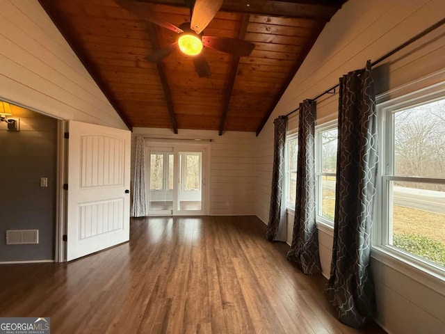 unfurnished sunroom featuring wood ceiling, ceiling fan, and lofted ceiling with beams