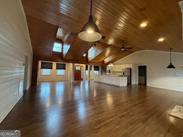 unfurnished living room featuring wood ceiling, dark wood-type flooring, high vaulted ceiling, and ceiling fan