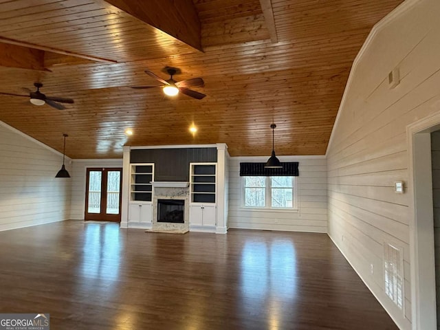 unfurnished living room featuring lofted ceiling, dark hardwood / wood-style flooring, wooden ceiling, and ceiling fan