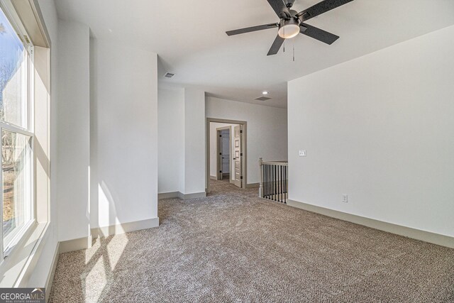 unfurnished room featuring carpet flooring