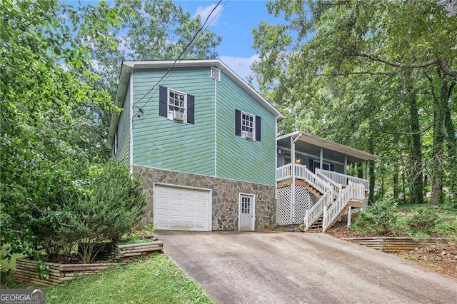 view of front facade with a garage and covered porch