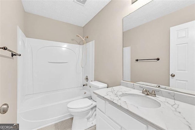 full bathroom with vanity, toilet, tub / shower combination, and a textured ceiling