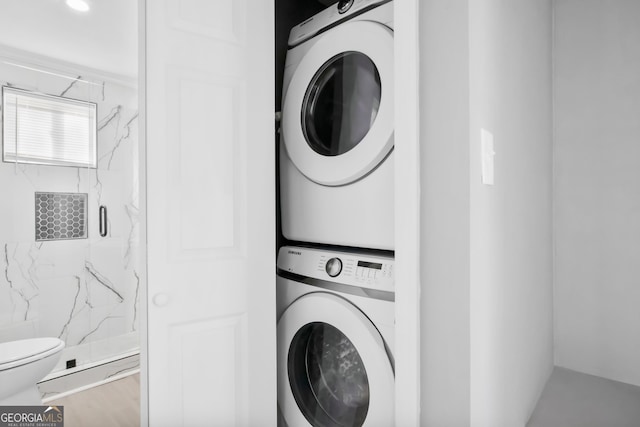 laundry room featuring stacked washing maching and dryer