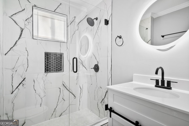 bathroom featuring an enclosed shower, vanity, and crown molding