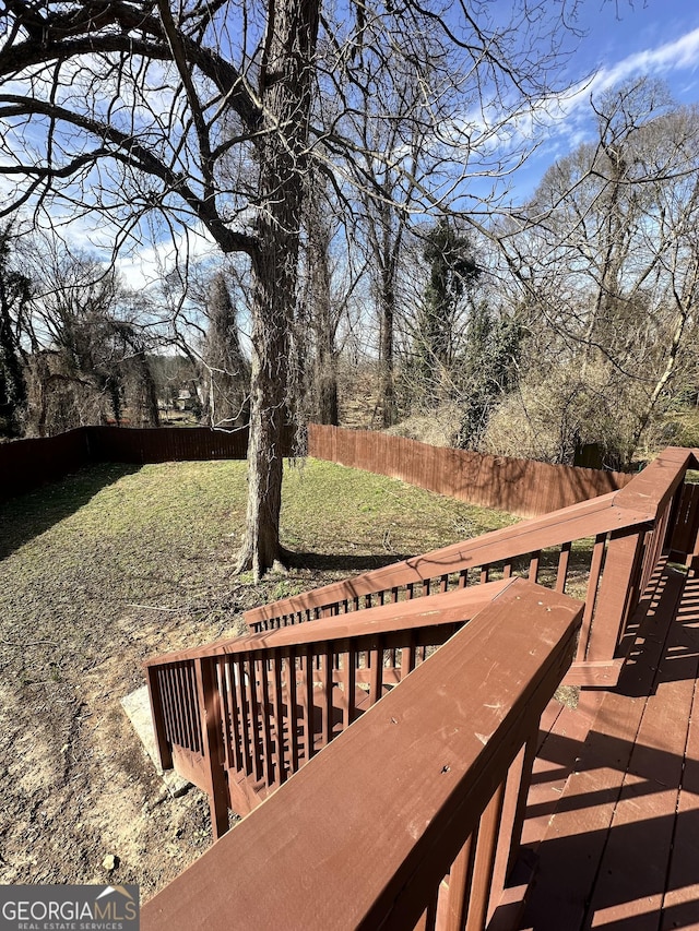 deck featuring a yard