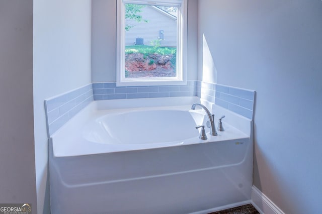 bathroom with a washtub