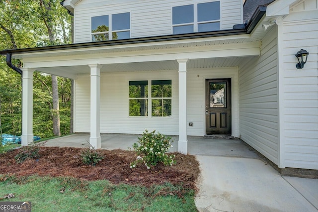 property entrance featuring covered porch