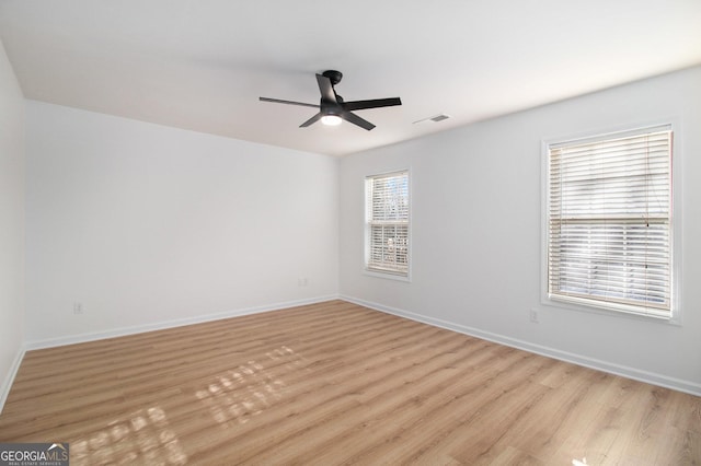 unfurnished room with light hardwood / wood-style floors and ceiling fan