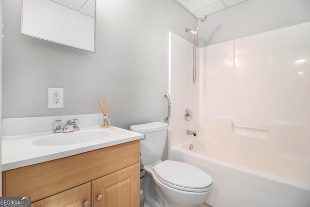 full bathroom featuring vanity, bathtub / shower combination, and toilet