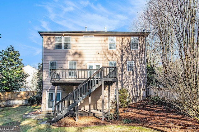 back of property featuring a deck