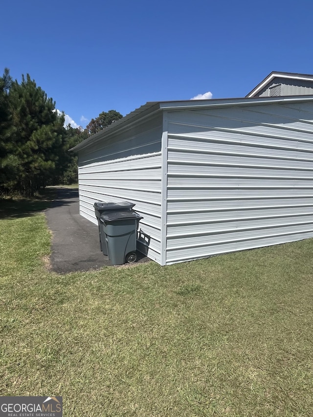 view of home's exterior with a yard