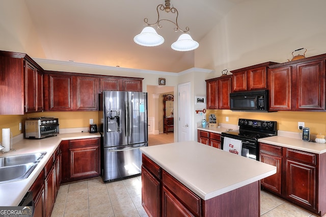 kitchen featuring sink, hanging light fixtures, a center island, black appliances, and light tile patterned flooring