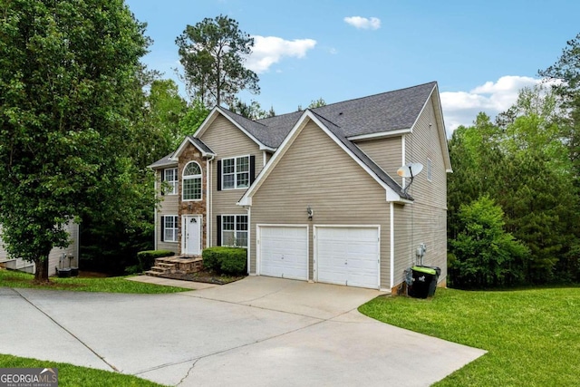 view of front facade with a garage and a front yard