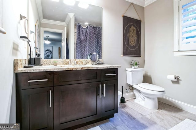 bathroom with vanity, ornamental molding, toilet, and a shower with shower curtain