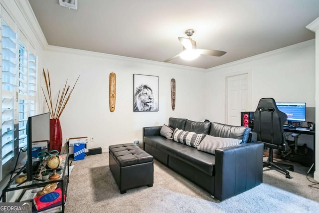 living room featuring ornamental molding, carpet, and ceiling fan