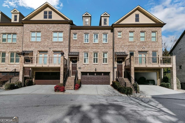 multi unit property featuring a garage