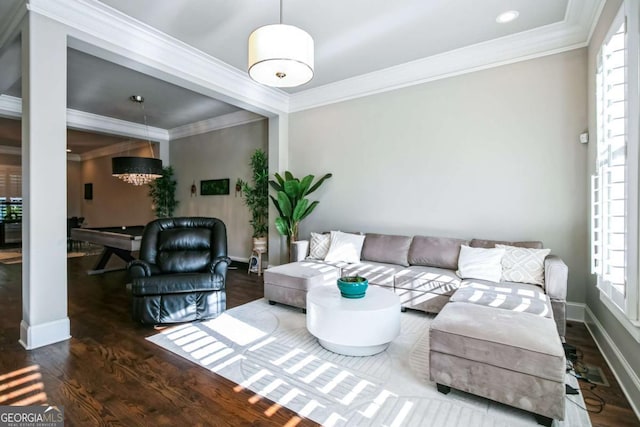 living room with ornamental molding and dark hardwood / wood-style floors