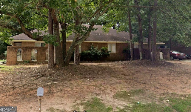 ranch-style house with brick siding