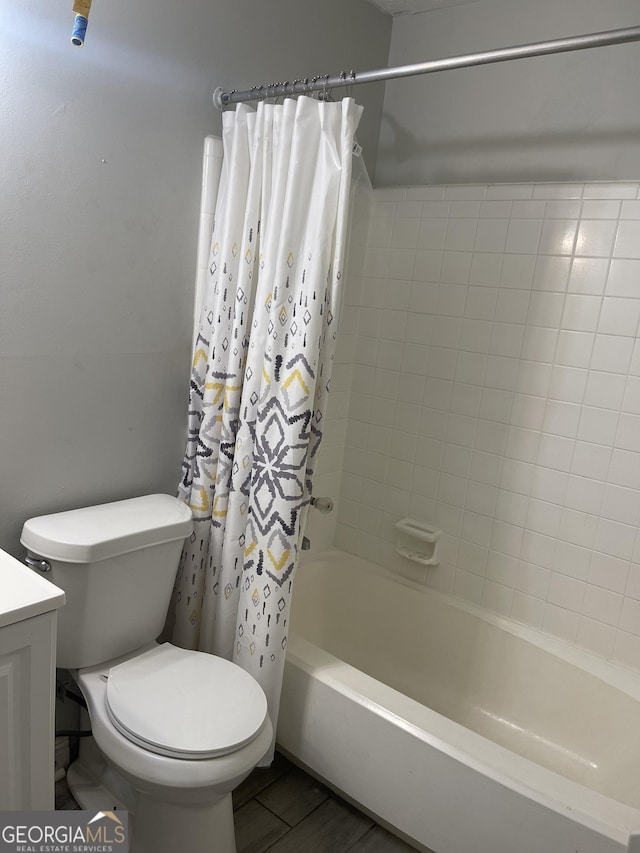 bathroom with toilet, shower / bath combo, wood finished floors, and vanity