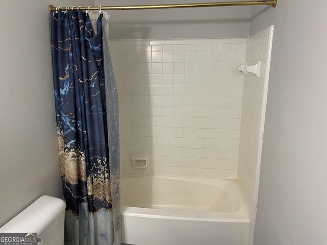 bathroom featuring vanity, a textured ceiling, and toilet