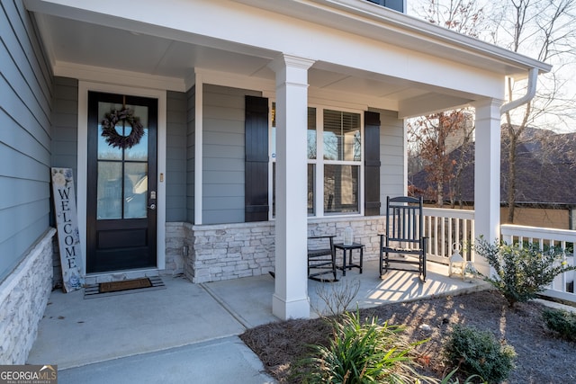 property entrance featuring a porch