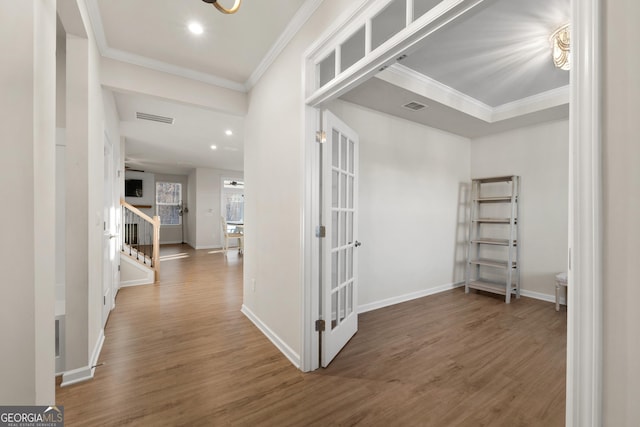 hall featuring crown molding and dark hardwood / wood-style flooring