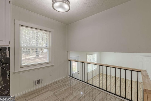 empty room with a textured ceiling