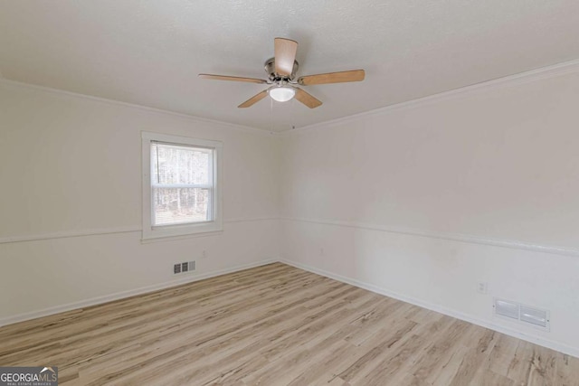 unfurnished room with crown molding, ceiling fan, light hardwood / wood-style floors, and a textured ceiling