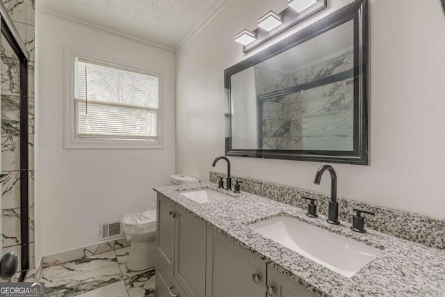 bathroom with an enclosed shower, vanity, ornamental molding, a textured ceiling, and toilet