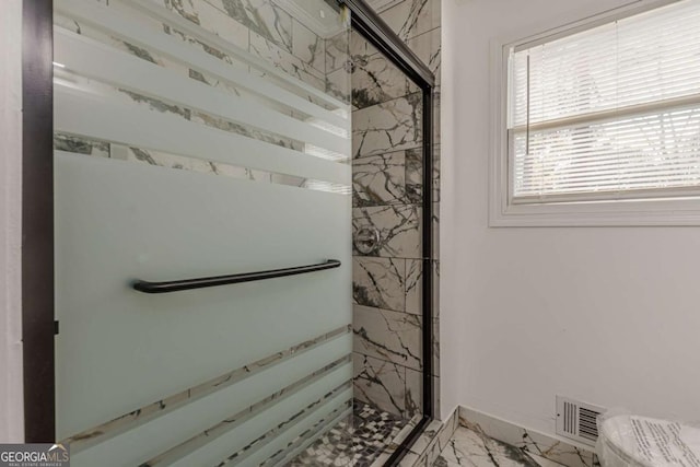 bathroom with an enclosed shower