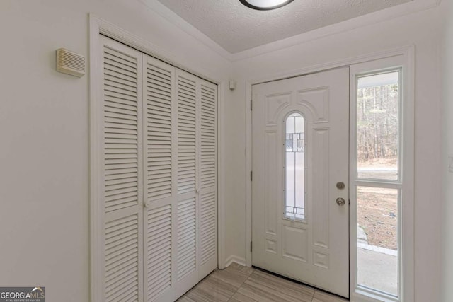 foyer featuring a textured ceiling